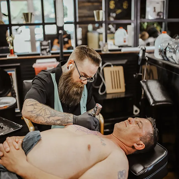 Joe Tower, tattoo artist at Sun Gold Tattoo & Barber