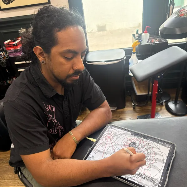 Manny Fares, tattoo artist at Living Canvas Tattoos